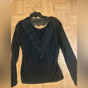 Women’s long sleeve shirt with lace accents on front and back.